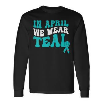 In April We Wear Teal Sexual Assault Awareness Retro Groovy Long Sleeve T-Shirt T-Shirt | Mazezy