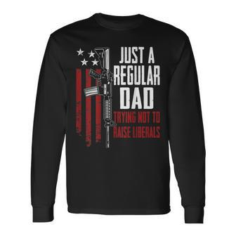Just A Regular Dad Trying Not To Raise Liberals On Back Long Sleeve T-Shirt - Seseable