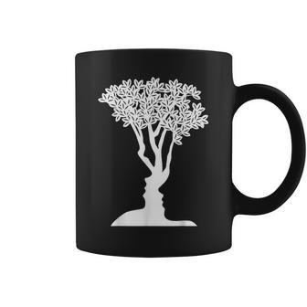 Optical Illusion Tree Man Woman Faces Coffee Mug | Mazezy