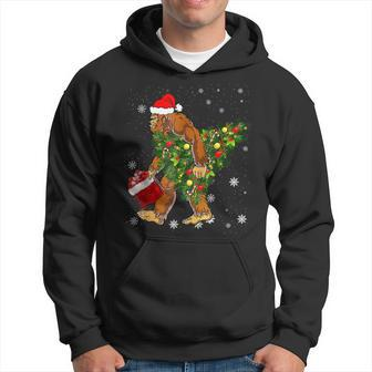 Bigfoot Carrying Christmas Tree Sasquatch Believer Pajama Men Hoodie Graphic Print Hooded Sweatshirt - Thegiftio UK