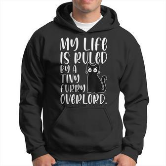 My Life Is Ruled By A Tiny Furry Overlord Cat Lover Funny Hoodie | Mazezy
