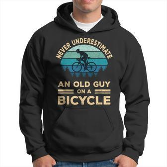 Never Underestimate An Old Guy On A Bicycle Funny Biker Dad Hoodie - Seseable