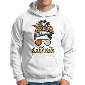 Busy Raising Ballers Basketball And Volleyball Mom Messy Bun Hoodie | Mazezy