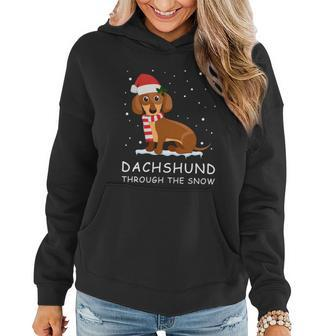 Merry Christmas Dachshund Dog Through The Snow Women Hoodie - Monsterry DE