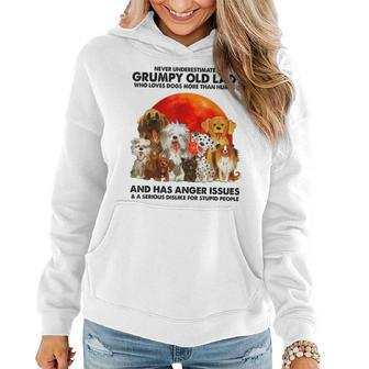 Never Underestimate A Grumpy Old Lady Who Loves Dogs Women Hoodie - Thegiftio UK