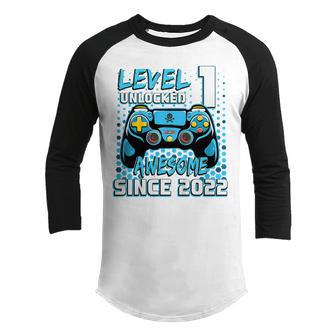 Kids Level 1 Unlocked Awesome Since 2022 1St Birthday Boys Gifts V2 Youth Raglan Shirt - Thegiftio UK