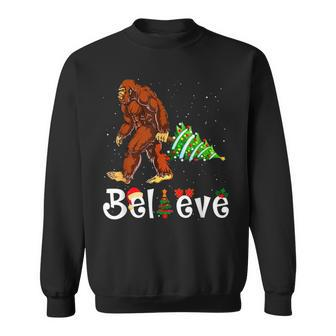 Believe Bigfoot Carrying Christmas Tree Funny Xmas Sasquatch Men Women Sweatshirt Graphic Print Unisex - Thegiftio UK