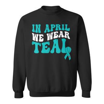 In April We Wear Teal Sexual Assault Awareness Retro Groovy Sweatshirt | Mazezy
