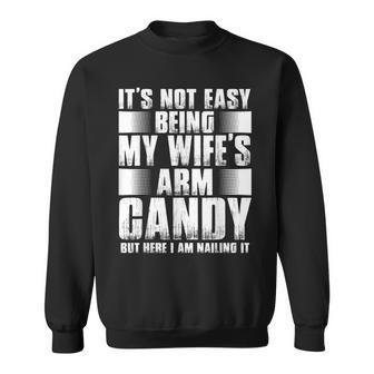 Its Not Easy Being My Wifes Arm Candy But Here Nailing It Gift For Mens Sweatshirt | Mazezy