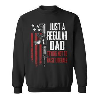 Just A Regular Dad Trying Not To Raise Liberals - On Back Sweatshirt - Seseable