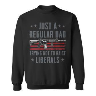 Regular Dad Trying Not To Raise Liberals - Pro Gun - On Back Sweatshirt - Seseable