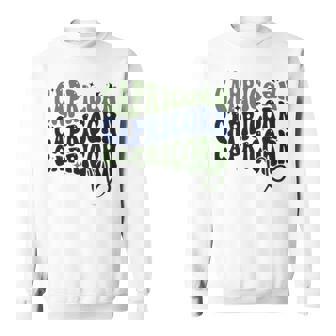 Retro Groovy Capricorn Zodiac Sign Sweatshirt | Mazezy