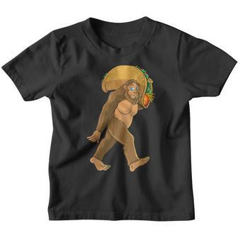 Bigfoot Carrying Taco Funny Cinco De Mayo Boys Men Sasquatch Youth T-shirt | Mazezy