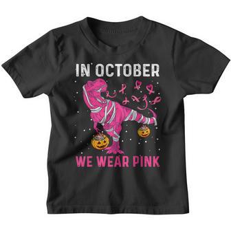 In October We Wear Pink Breast Cancer Dino Pumpkin Halloween Youth T-shirt - Thegiftio UK