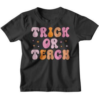 Retro Groovy Trick Or Teach Halloween For Teachers Youth T-shirt - Thegiftio UK