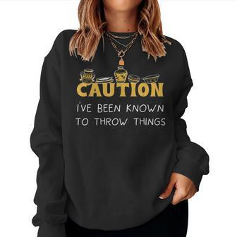 Caution Ive Been Known To Throw Things Women Sweatshirt | Mazezy