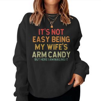 Its Not Easy Being My Wifes Arm Candy But Here I Am Nailin Women Crewneck Graphic Sweatshirt - Seseable