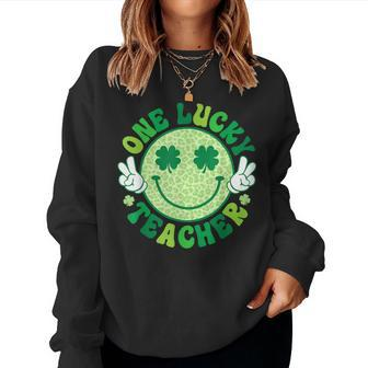 One Lucky Teacher Groovy Smile Face Patrick’S Day Shamrock Women Sweatshirt | Mazezy