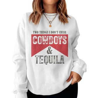 Two Things We Dont Chase Cowboys And Tequila Humor Women Sweatshirt | Mazezy