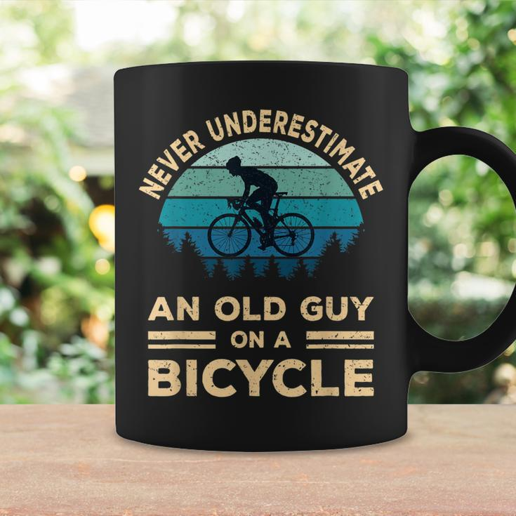 Never Underestimate An Old Guy On A Bicycle Funny Biker Dad Coffee Mug Gifts ideas