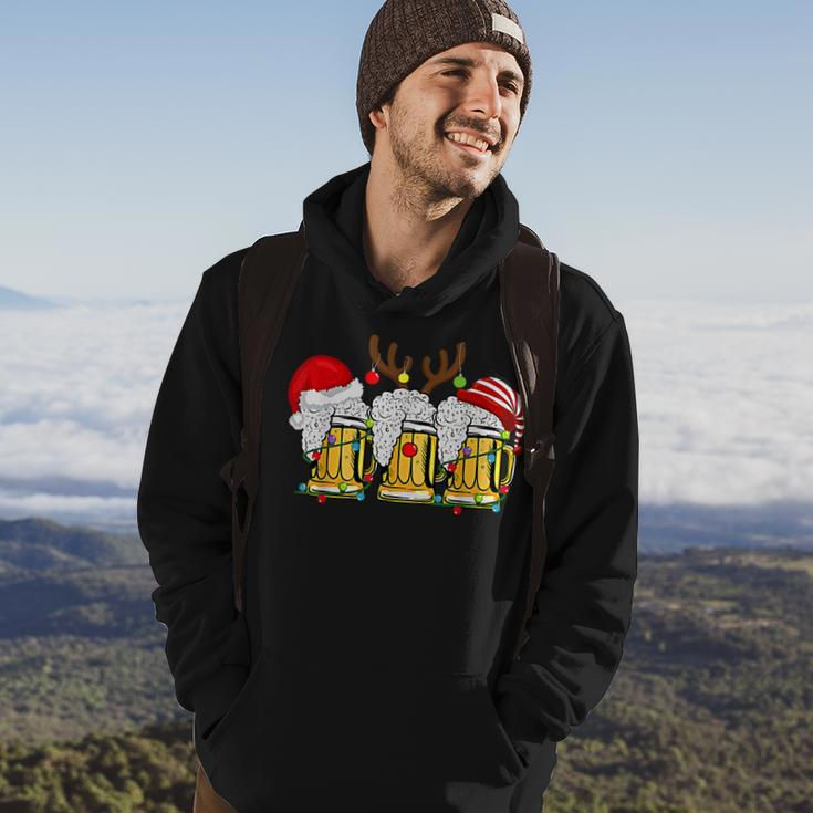Christmas Three Glass Of Beer Lights Santa Hat Elf Antlers V2 Men Hoodie Graphic Print Hooded Sweatshirt Lifestyle