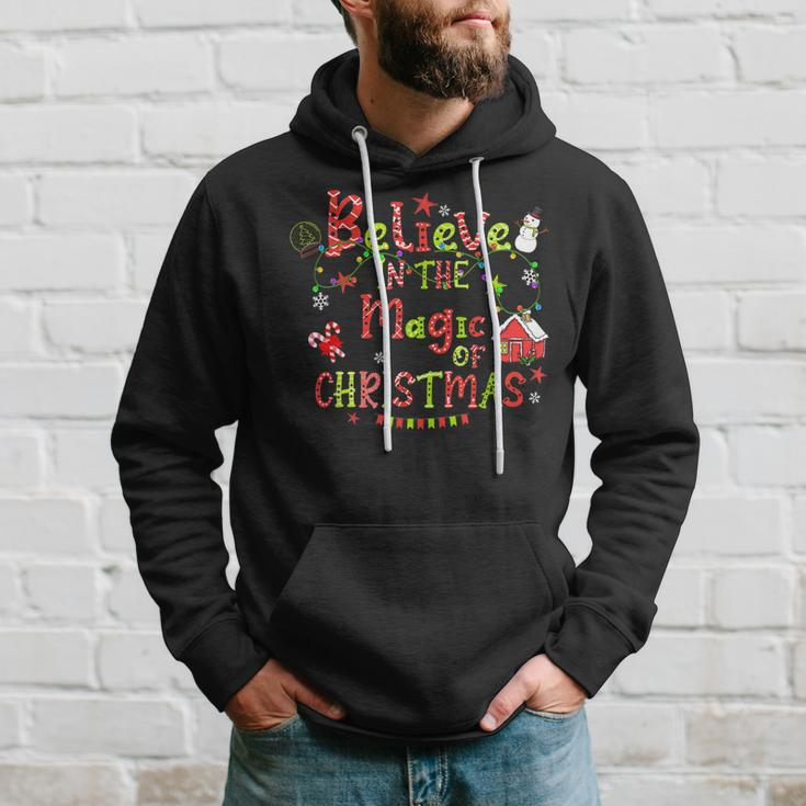 Believe In The Magic Of Christmas Santa Snowman Candy Cane Men Hoodie Graphic Print Hooded Sweatshirt Gifts for Him