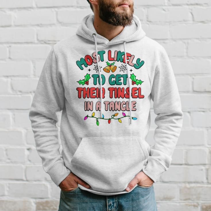 Most Likely To Get Their Tinsel In A Tangle Christmas Family Men Hoodie Graphic Print Hooded Sweatshirt Gifts for Him