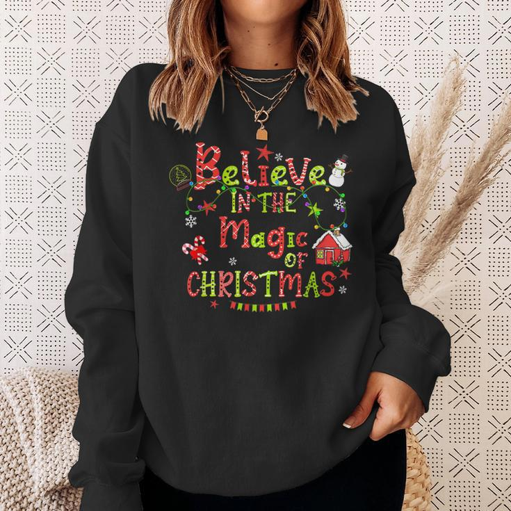 Believe In The Magic Of Christmas Santa Snowman Candy Cane Men Women Sweatshirt Graphic Print Unisex Gifts for Her