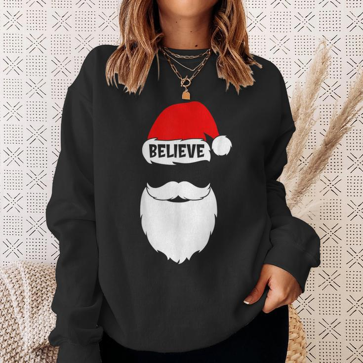 Christmas Believe In Santa Claus Believe Quote On Santa Hat Men Women Sweatshirt Graphic Print Unisex Gifts for Her