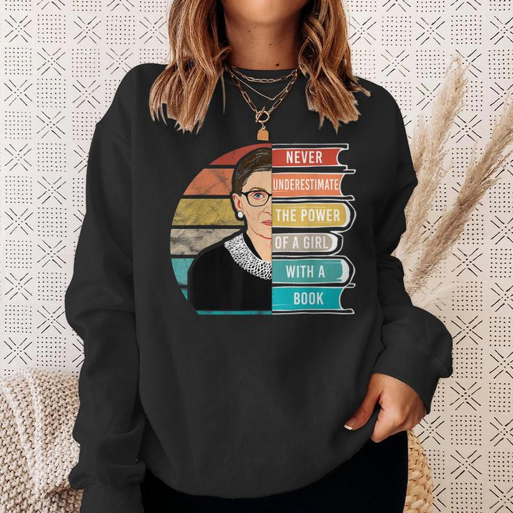 Never Underestimate The Power Of A Girl With Book Rbg Sweatshirt Gifts for Her