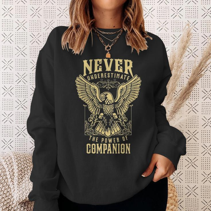 Never Underestimate The Power Of Companion Personalized Last Name Sweatshirt Gifts for Her