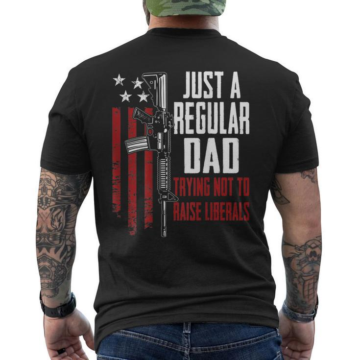 Just A Regular Dad Trying Not To Raise Liberals On Back Mens Back Print T-shirt
