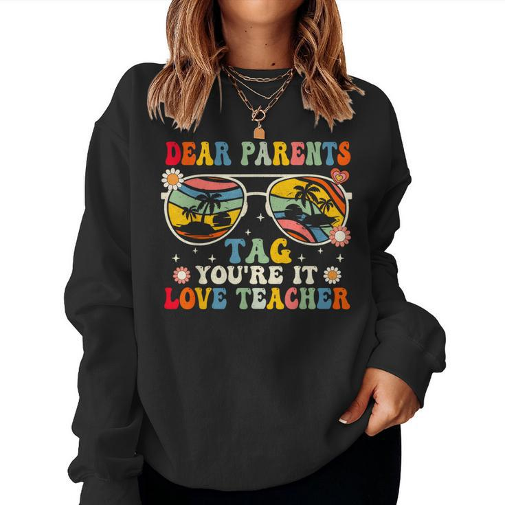 Groovy Dear Parents Tag Youre It Last Day Of School Teacher Women Sweatshirt