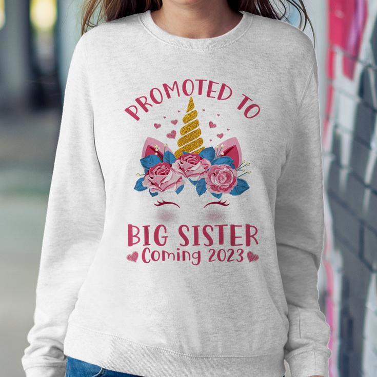 Promoted To Big Sister Coming 2023 Face Unicorn Baby Shower Women Sweatshirt Unique Gifts