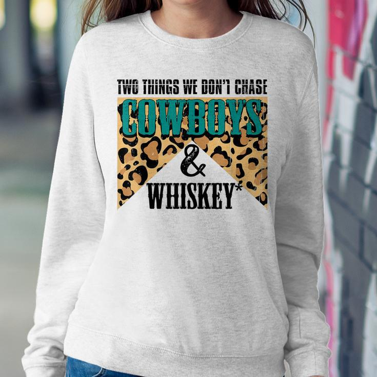Two Things We Dont Chase Cowboys And Whiskey Leopard Retro Women Sweatshirt Unique Gifts
