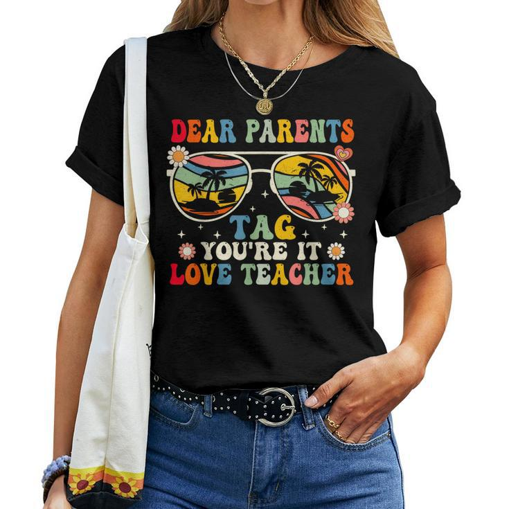 Groovy Dear Parents Tag Youre It Last Day Of School Teacher Women T-shirt