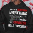 We Are Redefining Everything This Is A Cordless Hole Puncher Hoodie Funny Gifts