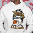 Busy Raising Ballers Basketball And Volleyball Mom Messy Bun Hoodie Unique Gifts